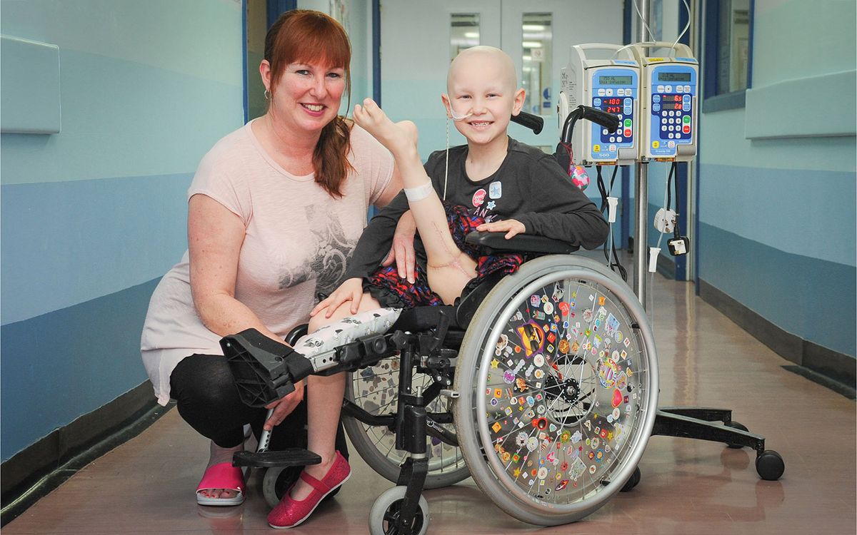 Seven-year-old Amelia Eldred had an unusal procedure to treat her bone cancer, called rotationplasty, in which part of her leg was amputated and reattached backwards. Above, Amelia with her mother Michelle.