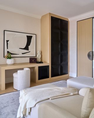 A bedroom with bespoke wardrobe and in-built desk