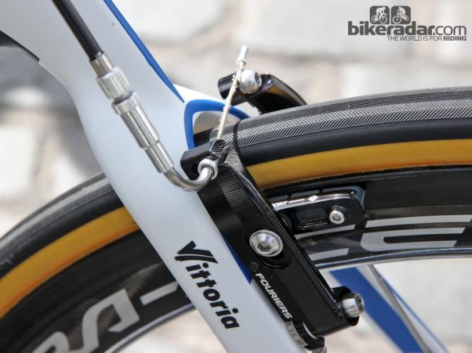 The Giant-Shimano's Giant Propel Advanced's use aftermarket Fouriers machined aluminum brakes instead of the molded carbon fiber ones sold on the stock bikes