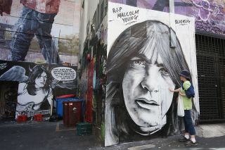 Fans have paid tribute to Malcolm Young in AC/DC Lane in Melbourne