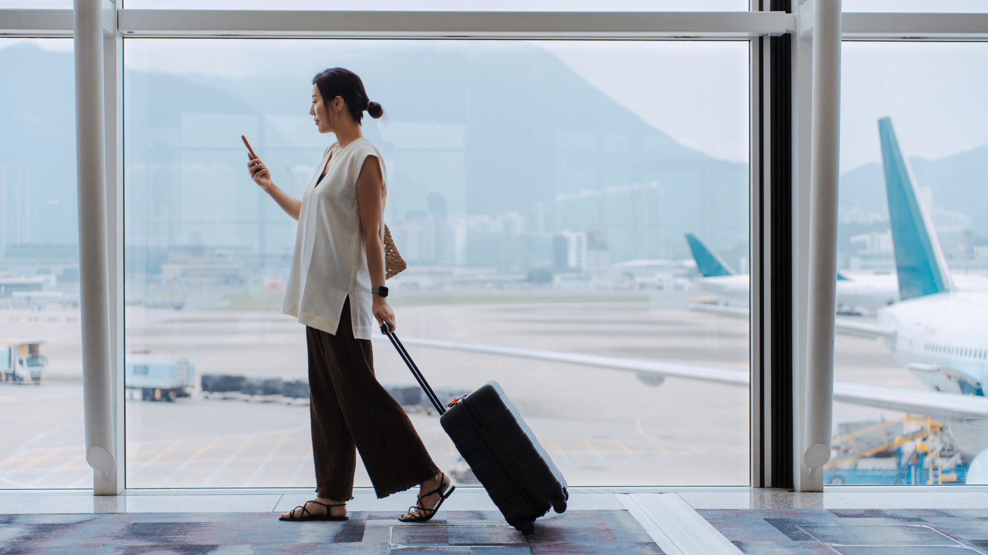 Woman walks through airport