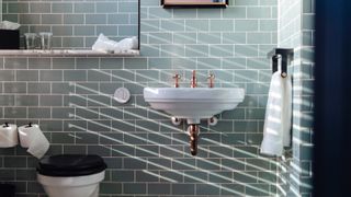 a tiled bathroom with a basin