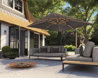 modern patio design with gravel inset and large parasol