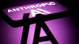 The Anthropic AI logo is displayed on a mobile phone with a visual digital reflected background in this photo illustration in Brussels, Belgium, on December 7, 2025. (Photo by Jonathan Raa/NurPhoto via Getty Images)
