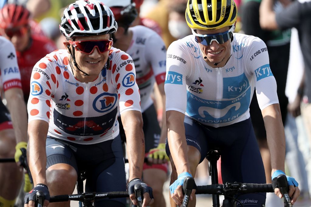 Team Ineos rider Ecuadors Richard Carapaz wearing the best climbers polka dot jersey L Team Movistar rider Spains Enric Mas wearing the best youngs white jersey attend the start of the 21st and last stage of the 107th edition of the Tour de France cycling race 122 km between ManteslaJolie and Champs Elysees Paris on September 20 2020 Photo by KENZO TRIBOUILLARD AFP Photo by KENZO TRIBOUILLARDAFP via Getty Images