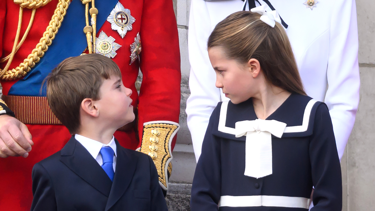 Prince Louis of Wales and Princess Charlotte of Wales on the balcony of Buckingham Palace during Trooping the Colour on June 15, 2024 in London, England. 