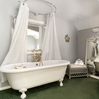 en suite bathroom with white bathtub