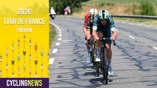 Head-on shot of Mads Pedersen in a breakaway during the Tour de France, overlaid with TDF banner