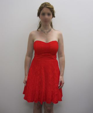 The picture used for the color manipulation in Experiments 1 and 2 (the face of the female target was intact in the experiment but is blurred here to protect privacy). The dress color was red or white.