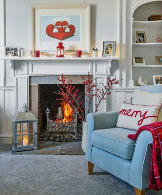 sofa with cushion wall painting and fire place