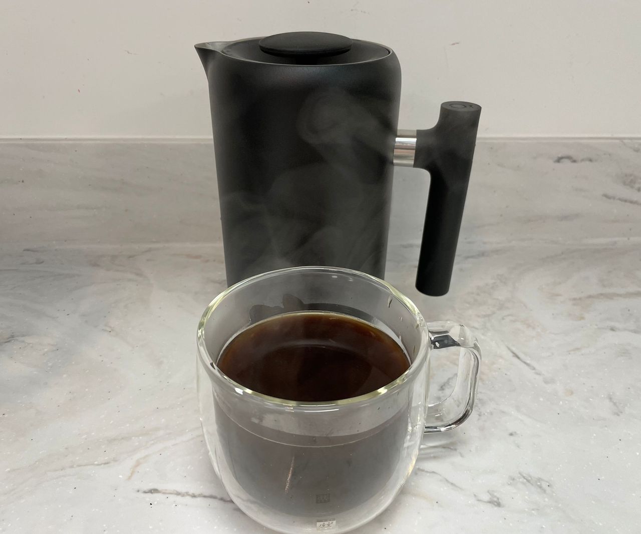 Fellow Clara French Press cup of coffee in front of the Fellow Clara French Press