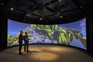 The cylinder display uses three projectors to light the 9.9-foot-high, 26.25-foot-diameter, 180-degree cylindrical projection screen.