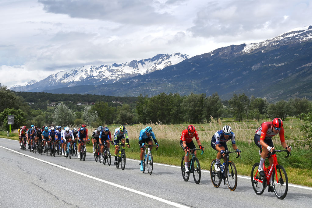 CASSANO MAGNAGO ITALY MAY 20 A general view of Davide Ballerini of Italy Pieter Serry of Belgium and Team Soudal Quick Step Nicolas Prodhomme of France Larry Warbasse of The United States and AG2R Citron Team Christian Scaroni of Italy and Astana Qazaqstan Team Andrea Pasqualon of Italy Jasha Stterlin of Germany and Team Bahrain Victorious Nico Denz of Germany and Team BORA hansgrohe Alberto Bettiol of Italy and Team EF EducationEasyPost Davide Bais of Italy and Team EOLOKometa Henok Mulubrhan of Eritrea and Team Green ProjectBardiani CSFFaizan Bruno Armirail of France and Team Groupama FDJ Laurenz Rex of Belgium and Team Intermarch Circus Wanty Fernando Gaviria of Colombia and Movistar Team Marius Mayrhofer of Germany and Team DSM Alessandro De Marchi of Italy and Team Jayco AlUla Bauke Mollema of The Netherlands and Otto Vergaerde of Belgium and Team Trek Segafredo compete in the breakaway passing through a Baltschieder village during the 106th Giro dItalia 2023 Stage 14 a 194km stage from Sierre to Cassano Magnago UCIWT on May 20 2023 in Cassano Magnago Italy Photo by Tim de WaeleGetty Images