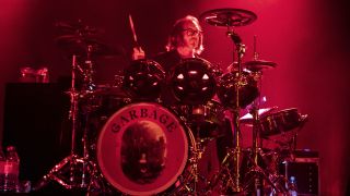 Butch Vig performing on stage with Roland VAD drums