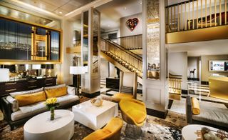 Hotel G lobby with white, yellow and gold interior