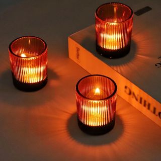 Three amber VOHO candle holders