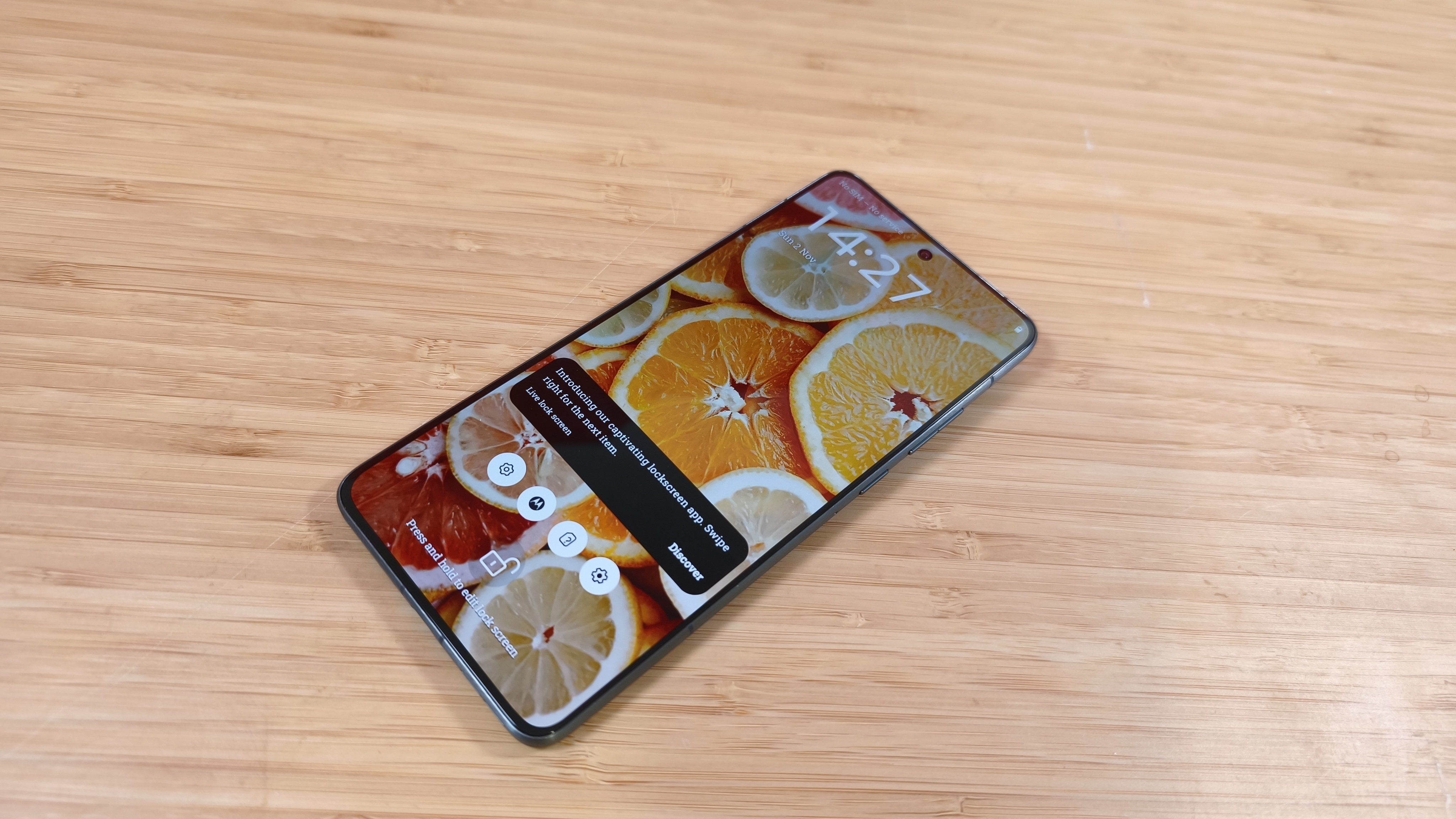 Motorola Edge 70 phone on a wooden desk