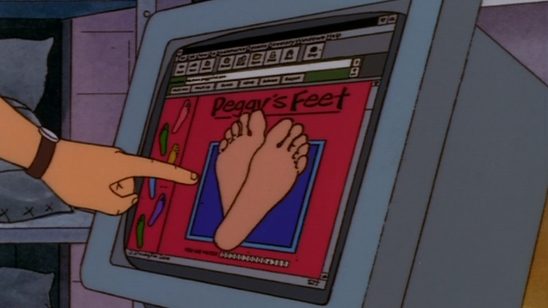 A man pointing to feet on a computer monitor in King of the Hill