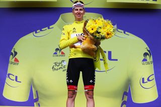 LIBOURNE FRANCE JULY 16 Tadej Pogaar of Slovenia and UAETeam Emirates yellow leader jersey celebrates at podium during the 108th Tour de France 2021 Stage 19 a 207km stage from Mourenx to Libourne Lion Mascot LeTour TDF2021 on July 16 2021 in Libourne France Photo by Tim de WaeleGetty Images
