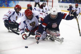 Paralympic ice hockey players double up on blades.