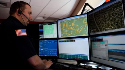 A 911 dispatcher at a call center in Denver.