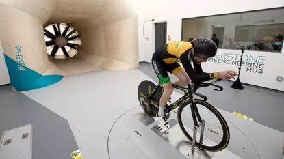 A time triallist in the aero position in a wind tunnel