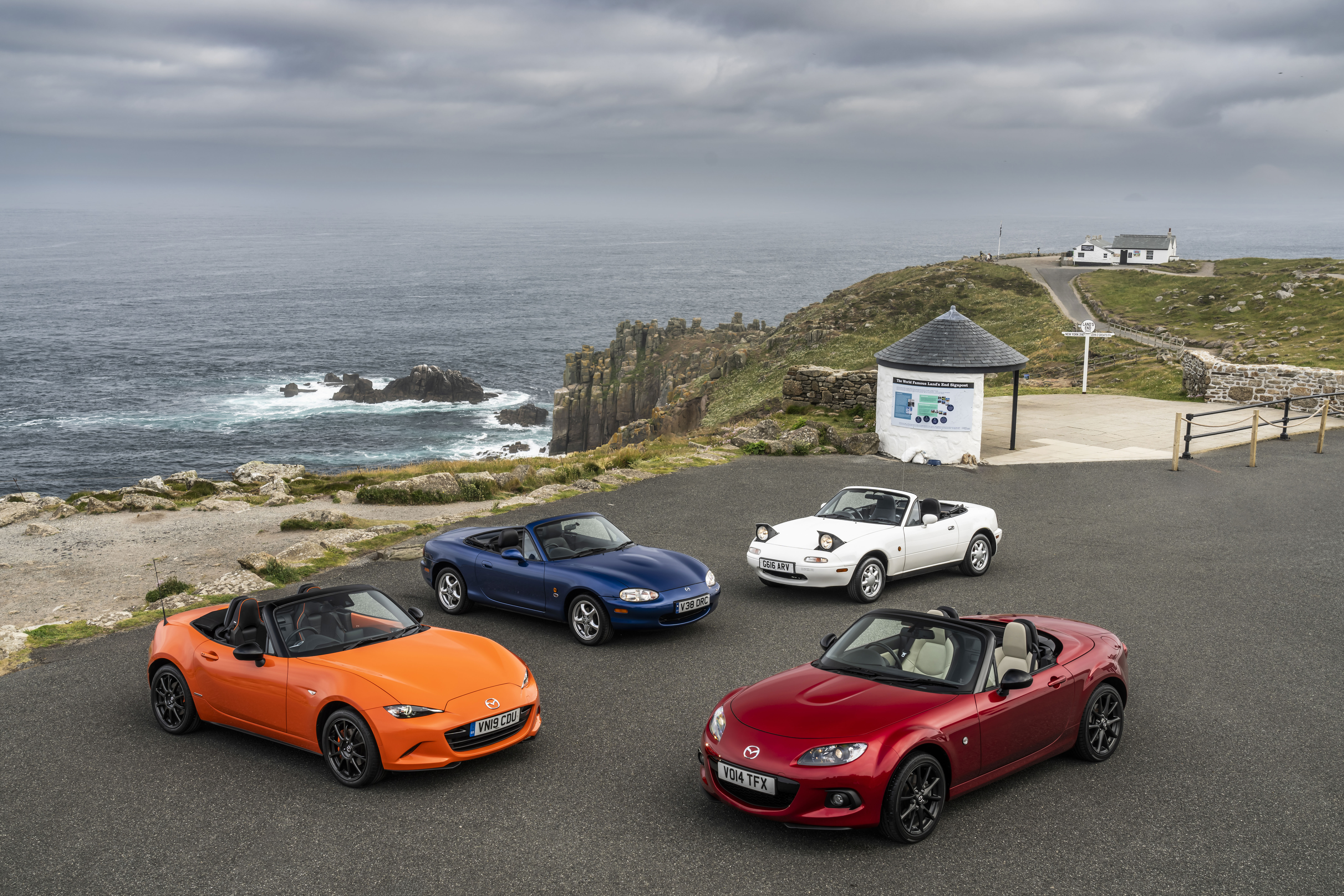 Four mazdas MX5 at Land's End in Cornwall