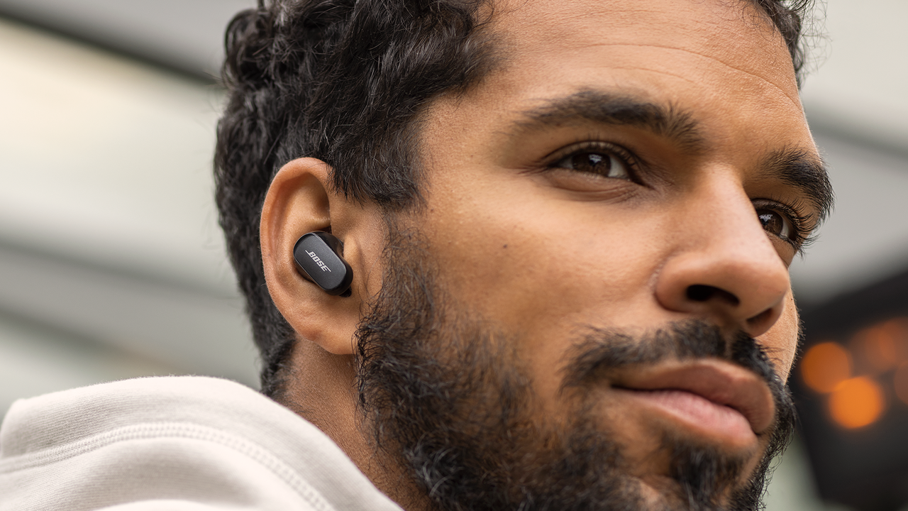 Bose QuietComfort Earbuds 2 being worn by adult human male