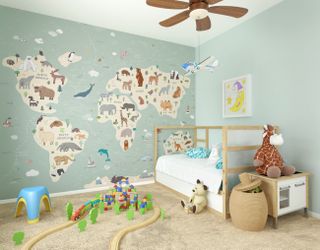 A children's bedroom with a full wall mural featuring a world map and illustrations