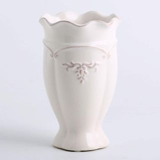 white ceramic vase with cottage detail