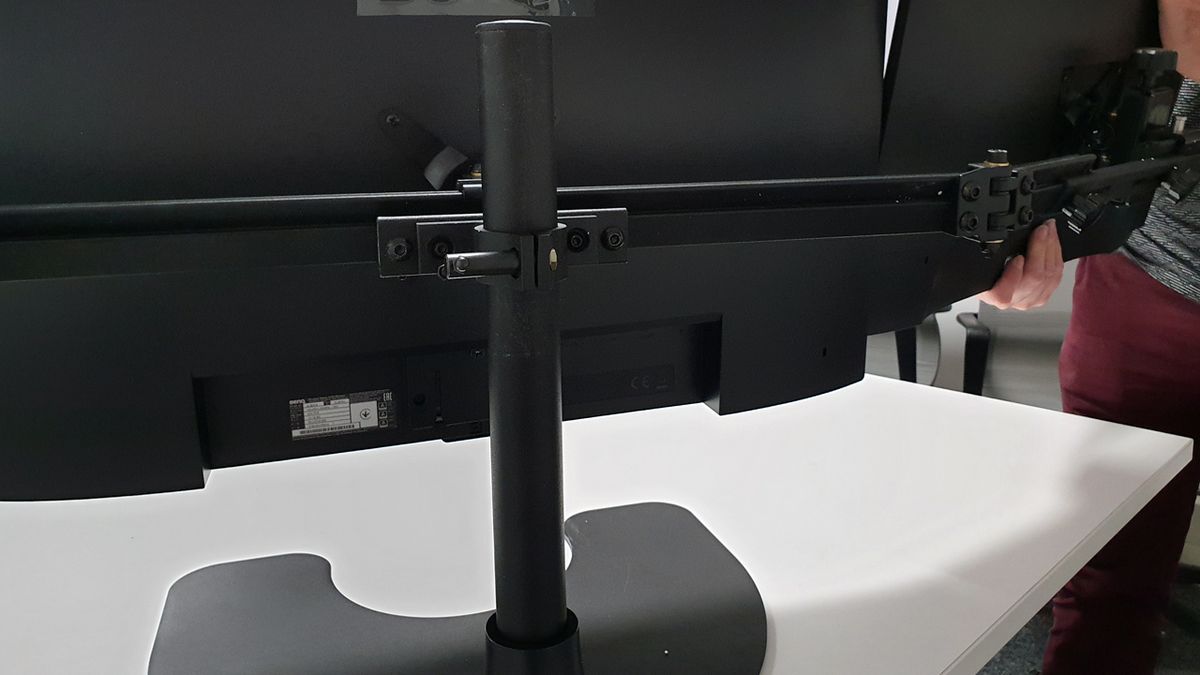 Attaching the outer monitors is just the same proces and the telescopic arms can adjust to your preferences and the monitors' sizes appropriately.