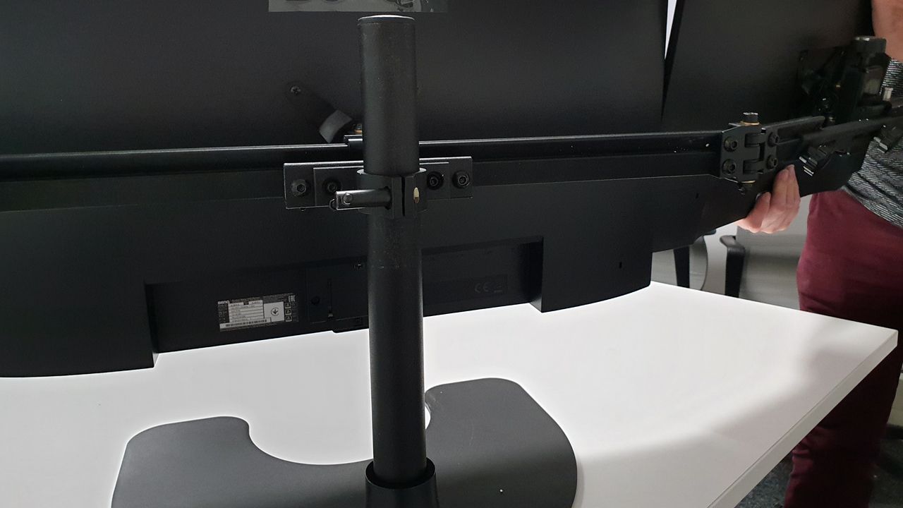 Attaching the outer monitors is just the same proces and the telescopic arms can adjust to your preferences and the monitors' sizes appropriately.
