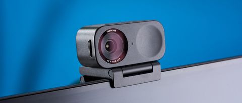 A black Insta360 Link 2C webcam with a magnetic L-shaped mount