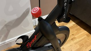 Echelon Sport Smart Connect indoor bike, close-up of resistance dial and water bottle holder