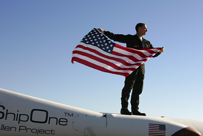 Brian Binnie with flag, x prize, spaceshipone