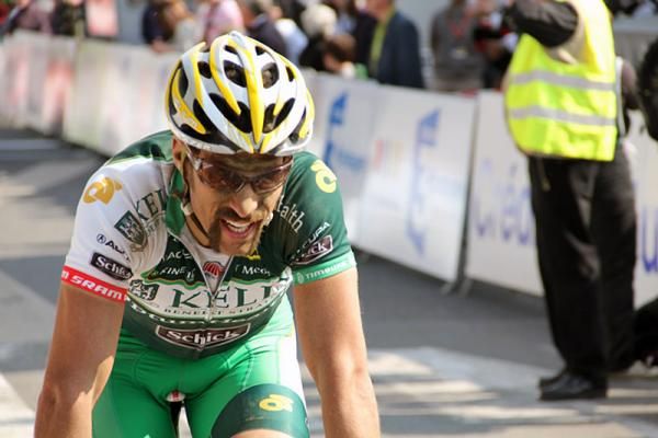 An exhausted Alex Candelario (Kelly Benefit Strategies-OptumHealth) crosses the finish line.