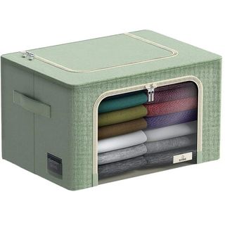 A green folding storage box with a zip lid and a zip clear front, fabric handles on either wide. folded bedding sets visible through the window. 