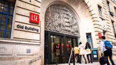 Students going through the front door of the main entrance to the LSE's Old Building
