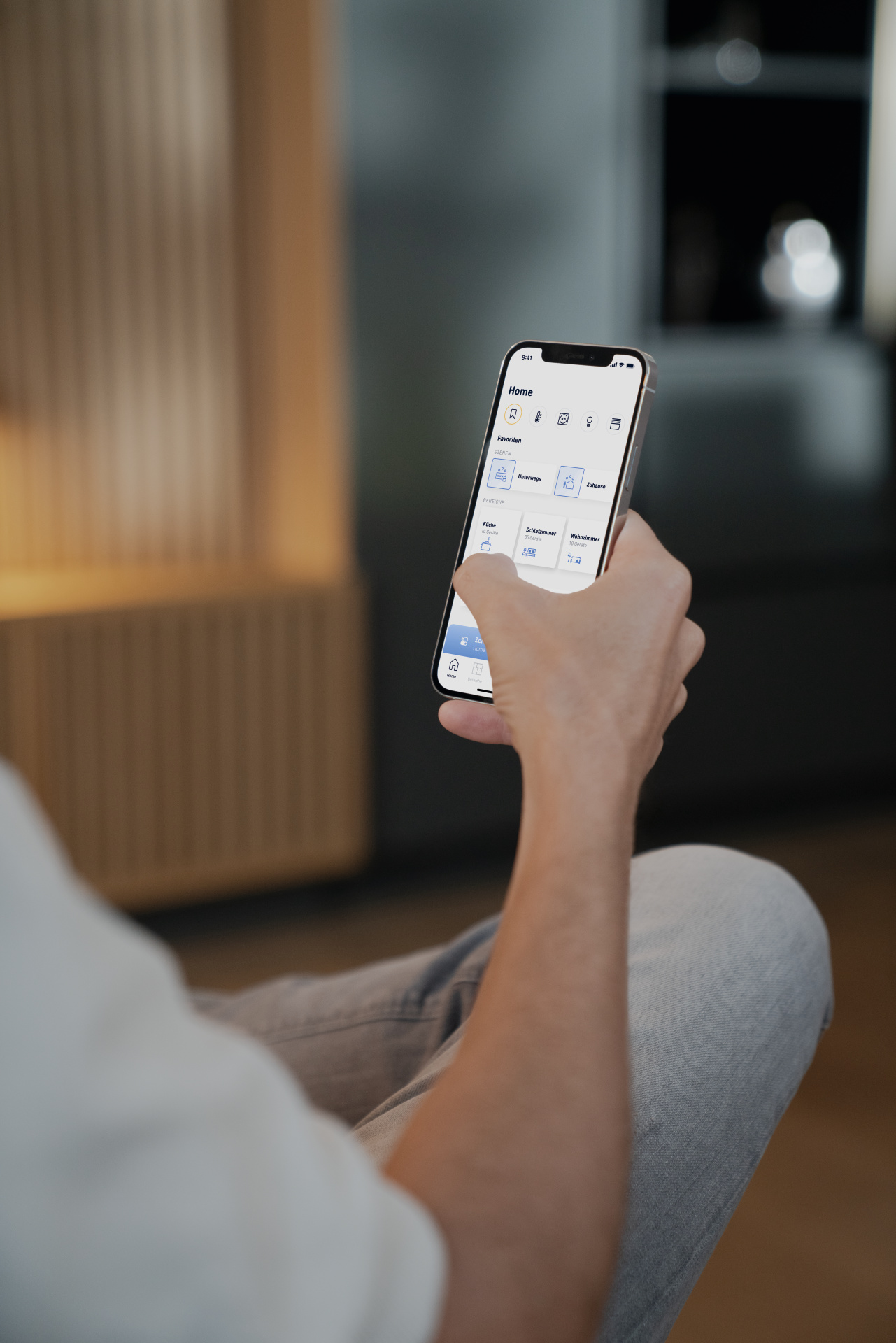 man holding smart phone with Jung app on screen