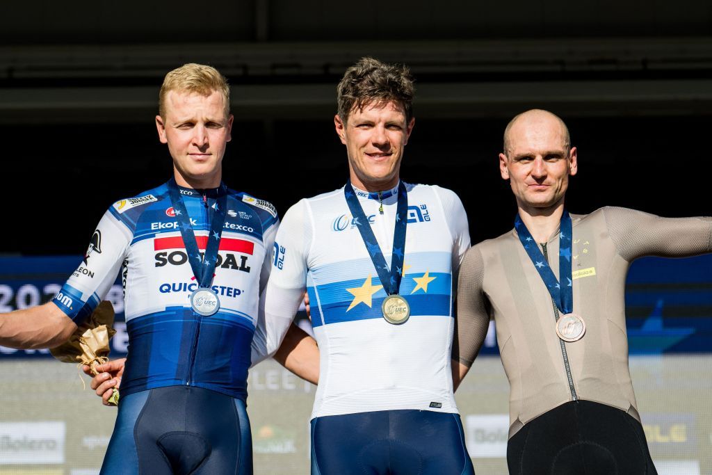 From L Secondplaced Belgian Tim Merlier winner Belgian Jasper Stuyven and thirdplaced German Paul Voss pose on the podium of the cycling elite race at the European Gravel Championships in Heverlee on October 1 2023 Photo by JASPER JACOBS Belga AFP Belgium OUT Photo by JASPER JACOBSBelgaAFP via Getty Images
