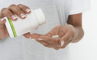 Woman with medicine bottle