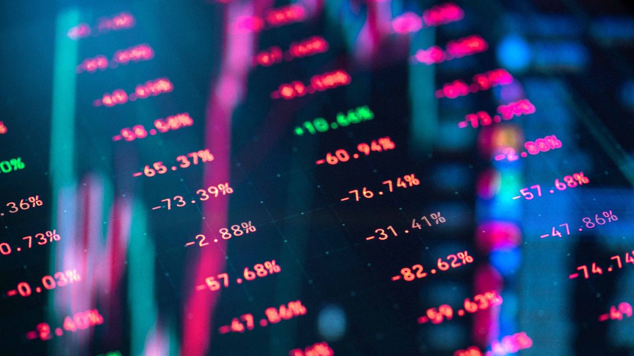 stock market ticker board with most tickers lower in red