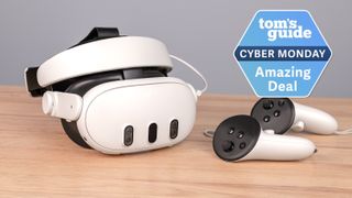 Meta Quest 3 with controllers on table with Tom's Guide Cyber Monday Amazing Deal badge