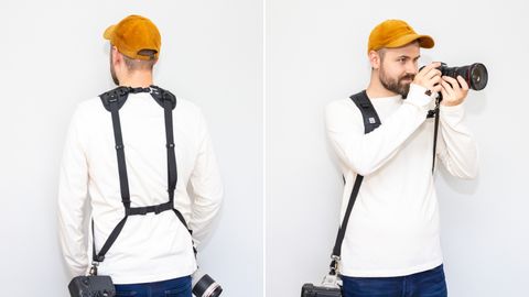 A man wearing the BlackRapid Double Breathe Dual Camera Harness Strap against a white background