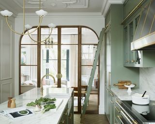 Green kitchen with marble countertop