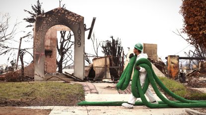 California Conservation Corps crews prepare burned sections of Pacific Palisades for rain