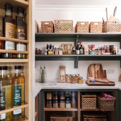detail of inside a kitchen pantry with shelving and door storage