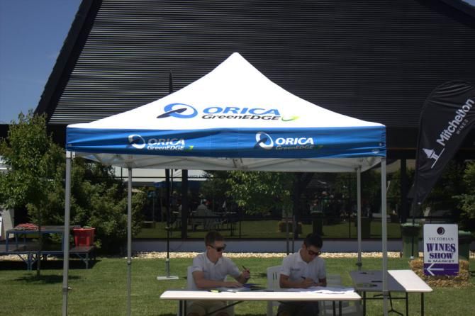 Simon Clarke and teammate Caleb Ewan at the signing tent during the Orica-GreenEdge River &amp; Ranges Winery Ride