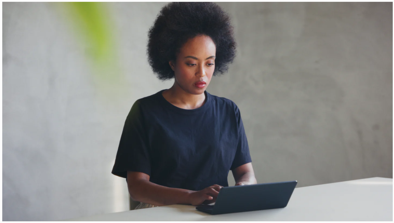 Woman typing on Pomera DM250US