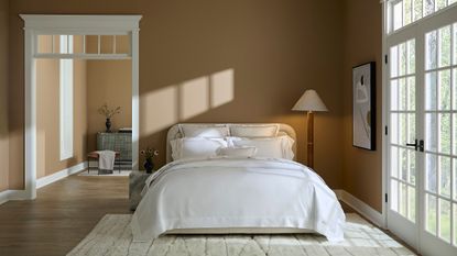 White Sferra Gize 45 Sateen bedding pictured in a neutral sunlit bedroom alongside contemporary art and an oversized floor lamp